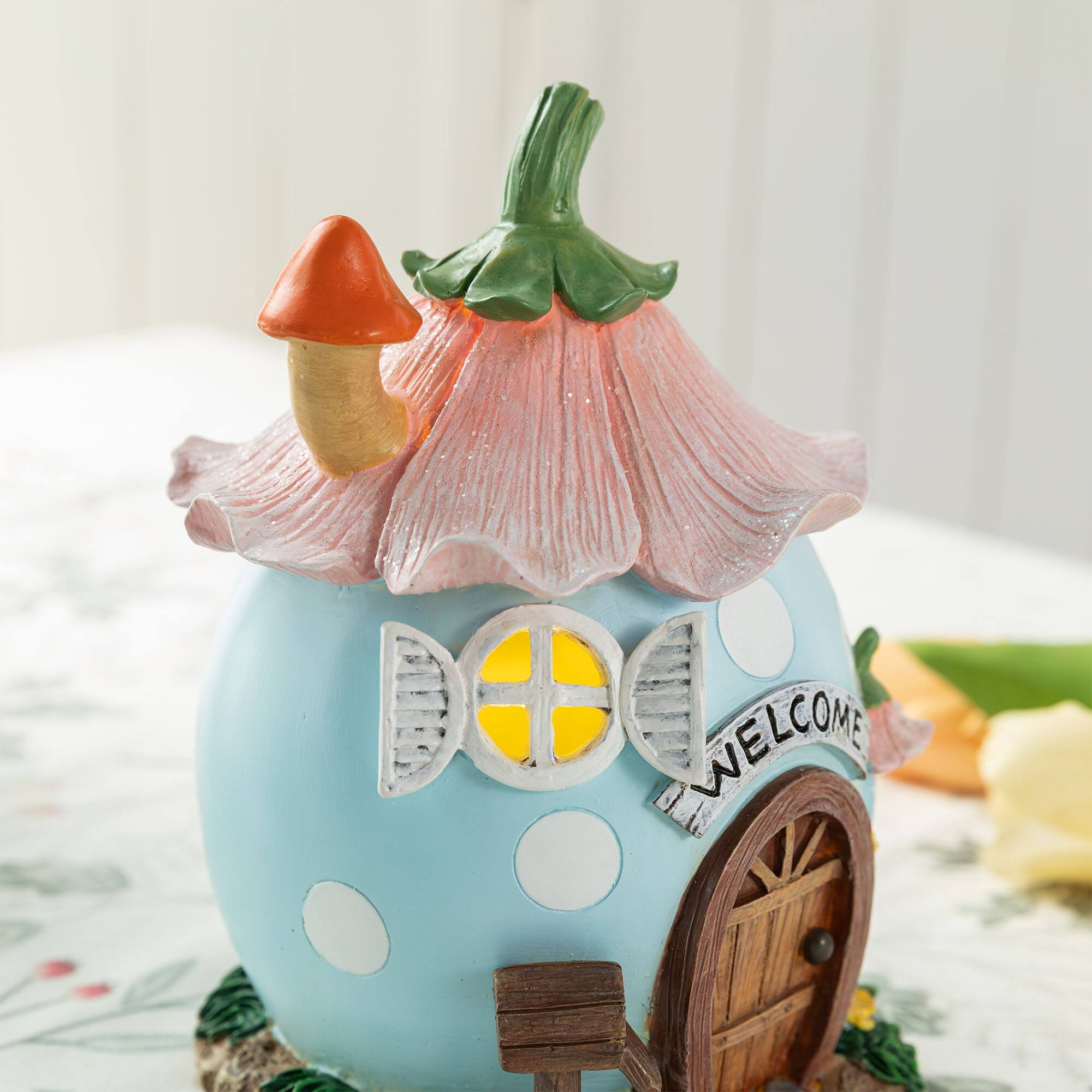 Glitzhome® 8" Lighted Easter Resin Egg-Shaped House Table Decor